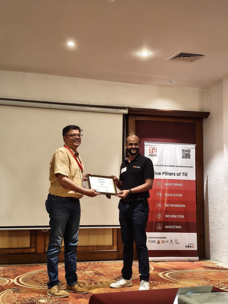 Rohit receiving a certificate at TiE Pune